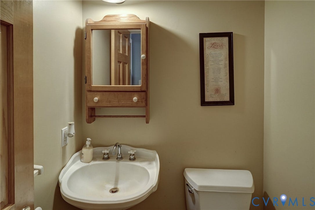 2180 Gum Drive, Smokey Hollow, Manakin Sabot, VA 23103 Half Bath off Foyer; Hardwood Floors, Pedestal Sink