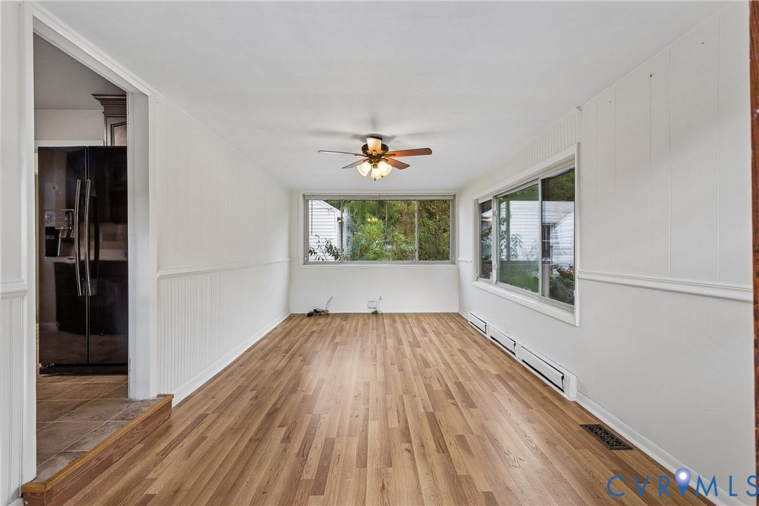 627 Sedgefield Drive, 992- All Others Area 107, Newport News, VA 23605 Sunroom featuring wood-finish flooring, beadboard wall paneling, a ceiling fan with integrated lighting, and large windows