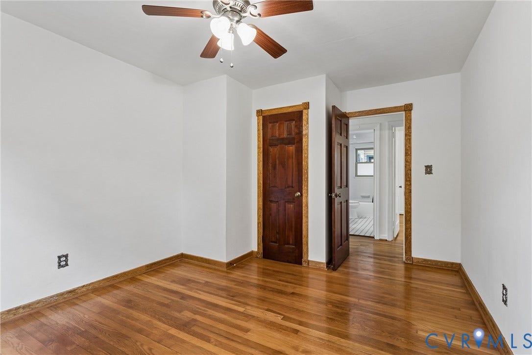 627 Sedgefield Drive, 992- All Others Area 107, Newport News, VA 23605 Room featuring wood-finish flooring, six-panel wood doors, stained wood trim, and a ceiling fan with integrated lighting