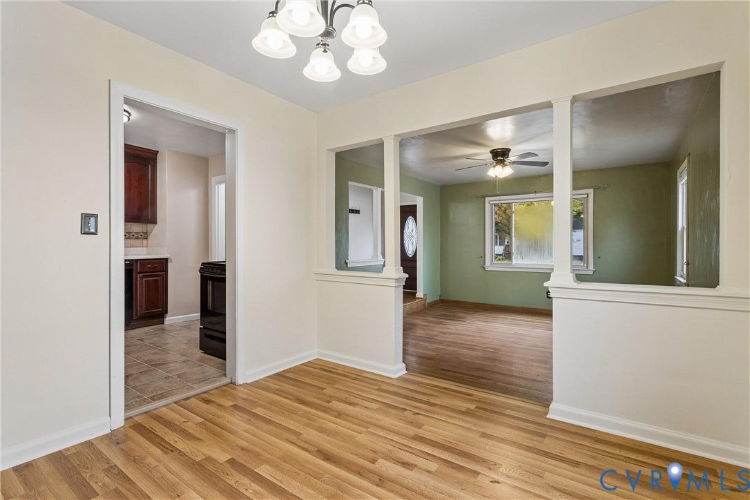 627 Sedgefield Drive, 992- All Others Area 107, Newport News, VA 23605 Dining area featuring wood-finish flooring, a multi-light chandelier, and decorative wall cutouts with chair rail molding