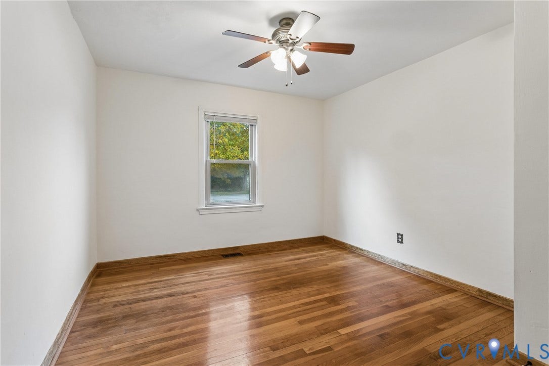 627 Sedgefield Drive, 992- All Others Area 107, Newport News, VA 23605 Room featuring wood-finish flooring, a central ceiling fan with integrated light fixture, and a single-pane window