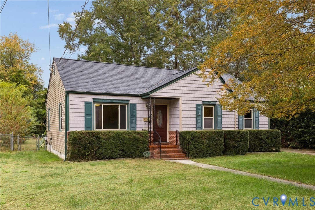 627 Sedgefield Drive, 992- All Others Area 107, Newport News, VA 23605 Exterior featuring light-toned shingle siding, brick-tread front steps, decorative window shutters, an arched-glass entry door, and a gabled roofline