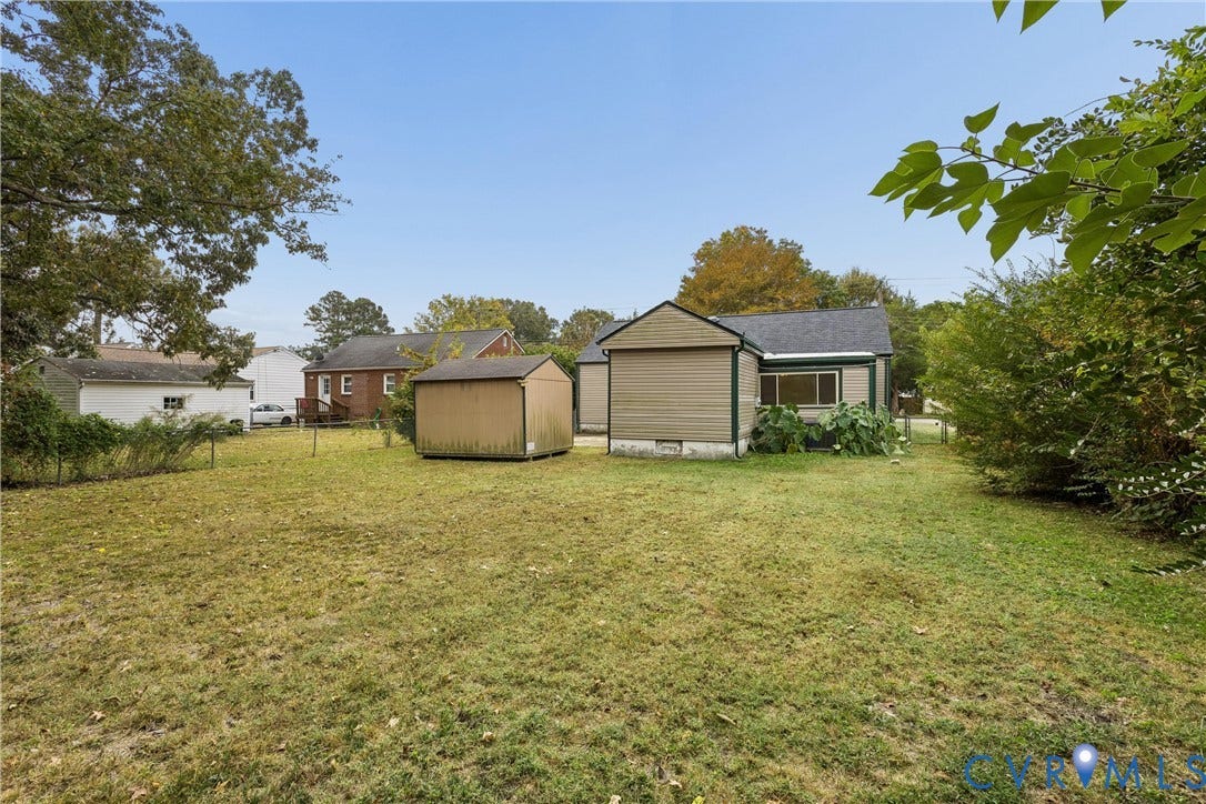 627 Sedgefield Drive, 992- All Others Area 107, Newport News, VA 23605 Expansive backyard featuring a level lawn, mature perimeter trees, a detached storage shed, and vinyl siding exterior finishes