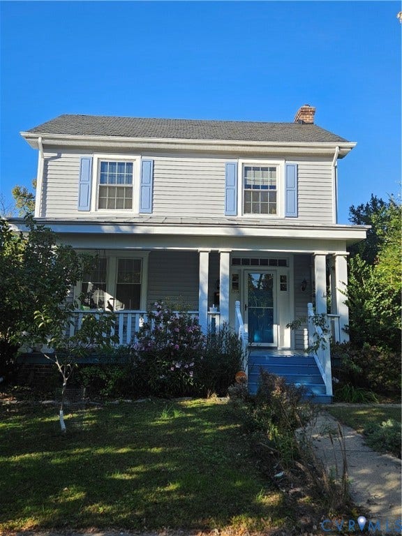 1206 Westminster Avenue, Richmond, VA 23227 Two-story residence featuring light gray horizontal siding, decorative blue shutters, a covered front porch with square columns, and a front entry door with transom and side lights