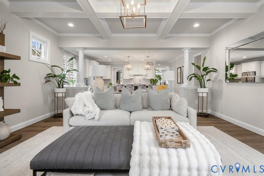 12168 Readers Pointe Drive, Readers Branch, Goochland, VA 23103 Coffered ceiling with crown molding, wood-finish flooring, architectural columns, geometric metal pendant lighting, and recessed ceiling lights