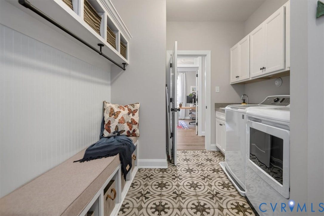 12168 Readers Pointe Drive, Readers Branch, Goochland, VA 23103 Utility room featuring patterned tile flooring, built-in cabinetry with white shaker-style doors, overhead storage cubbies, and a dedicated bench with lower storage compartments