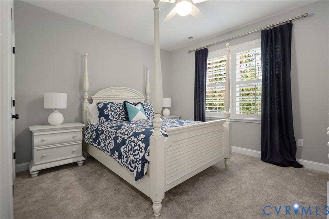 12168 Readers Pointe Drive, Readers Branch, Goochland, VA 23103 Terrace Level -Neutral-toned interior featuring wall-to-wall carpeting, white plantation shutters, and a ceiling-mounted light fixture with a fan