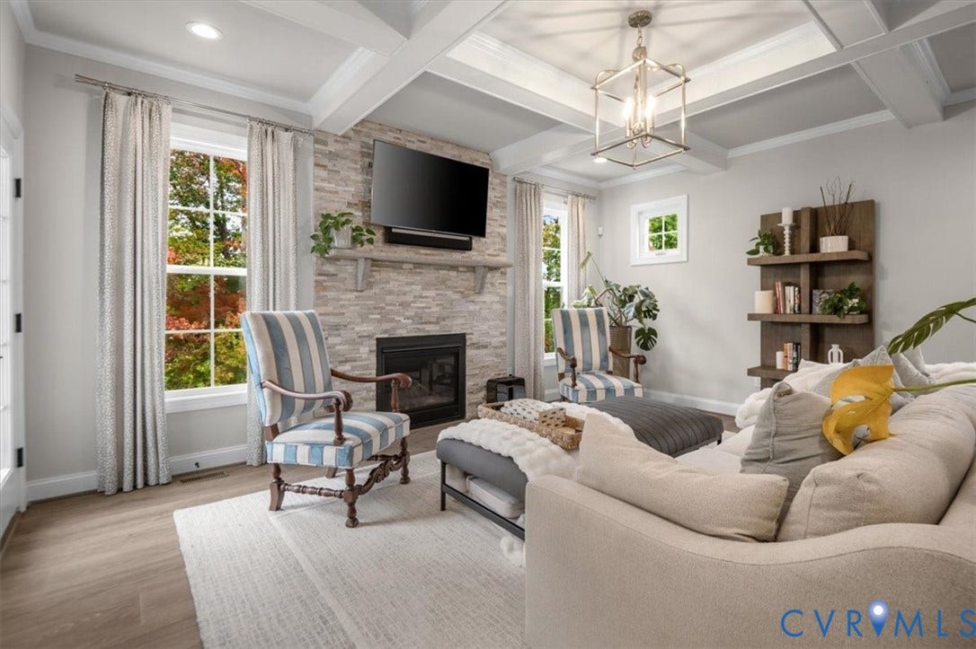 12168 Readers Pointe Drive, Readers Branch, Goochland, VA 23103 Coffered ceiling, stone-surround fireplace, built-in shelving, multi-pane windows, and wood-finish flooring