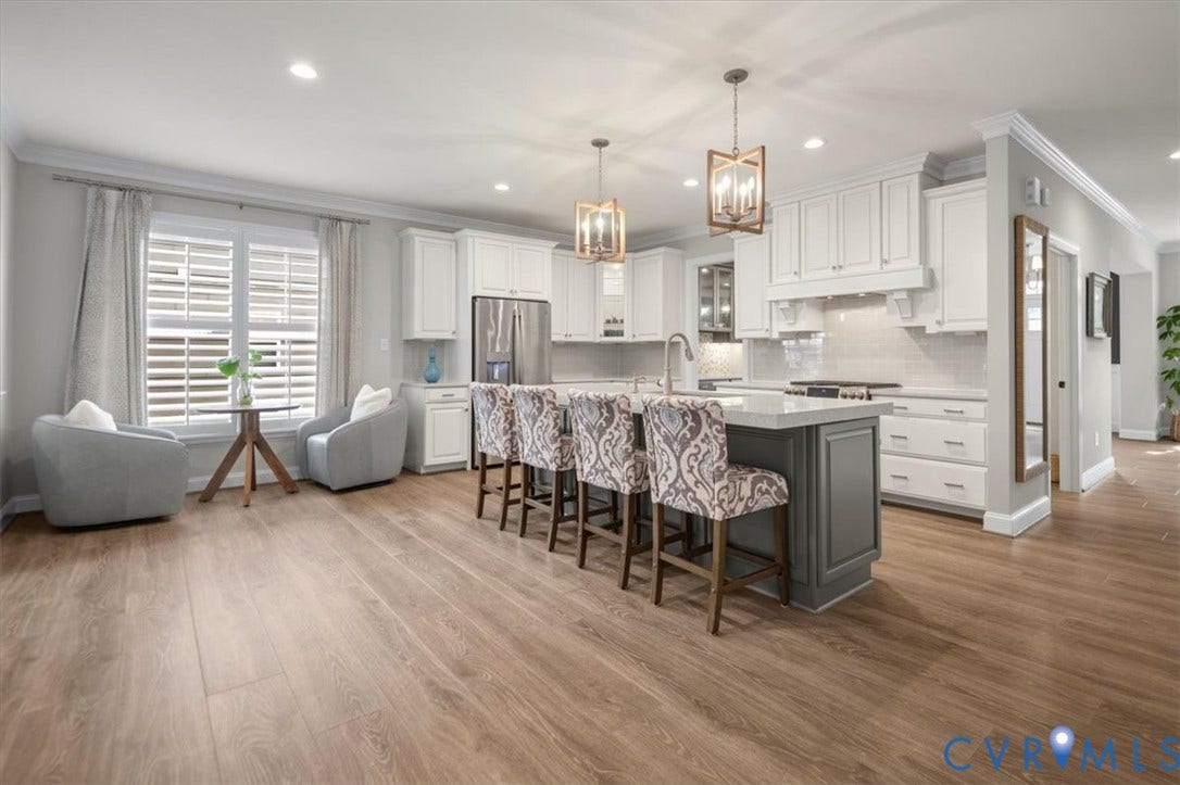 12168 Readers Pointe Drive, Readers Branch, Goochland, VA 23103 Kitchen featuring white cabinetry, quartz countertops, a grey central island, wood-finish flooring, and dual hanging pendant lights