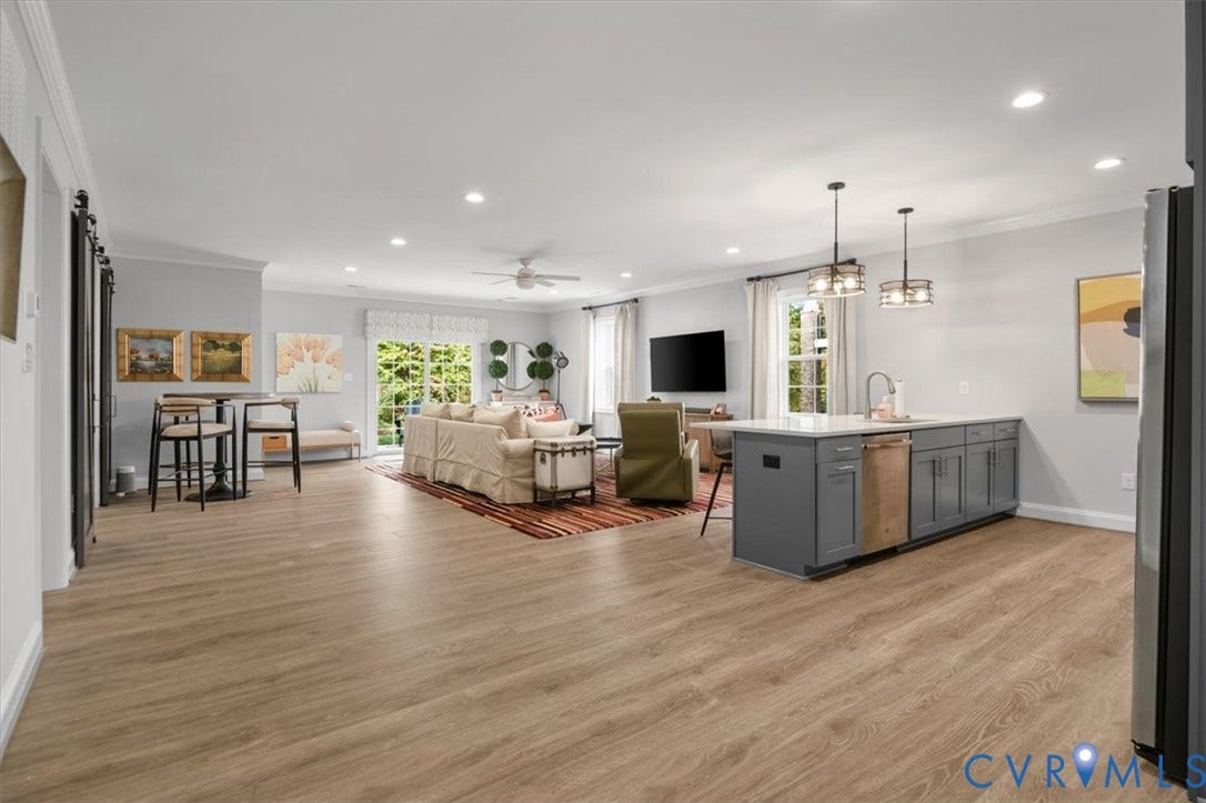 12168 Readers Pointe Drive, Readers Branch, Goochland, VA 23103 Terrace Level - Open-concept kitchen featuring an oversized island with gray cabinetry, recessed lighting, wood-finish flooring, and sliding glass patio doors