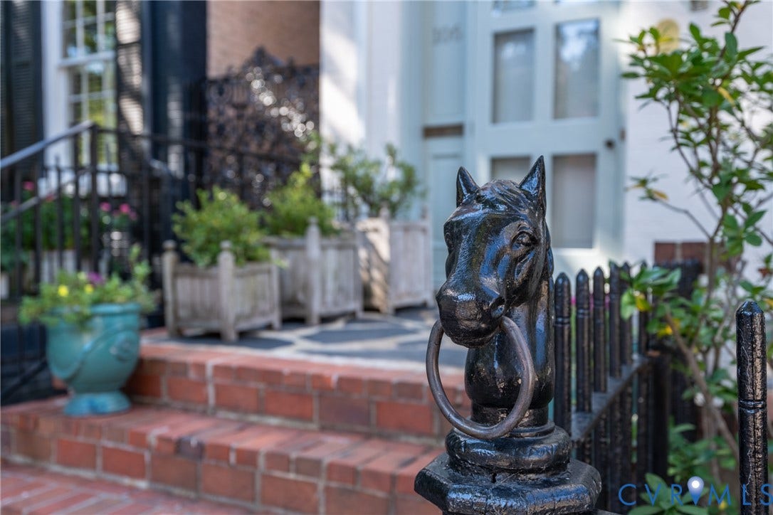 106 N Shields Avenue, The Fan, Richmond, VA 23220 Cast-iron horse-head hitching post on the front fence.