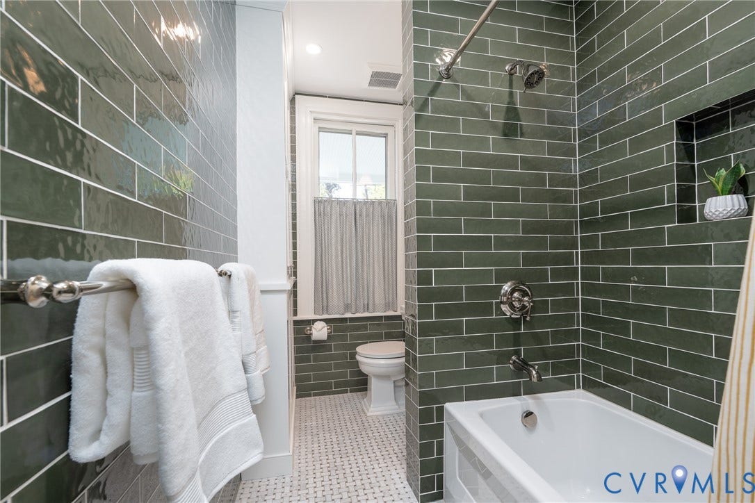 106 N Shields Avenue, The Fan, Richmond, VA 23220 Full bath redone in 2025 by Anne Pulliam Interiors, with designer tile and a heated marble floor.