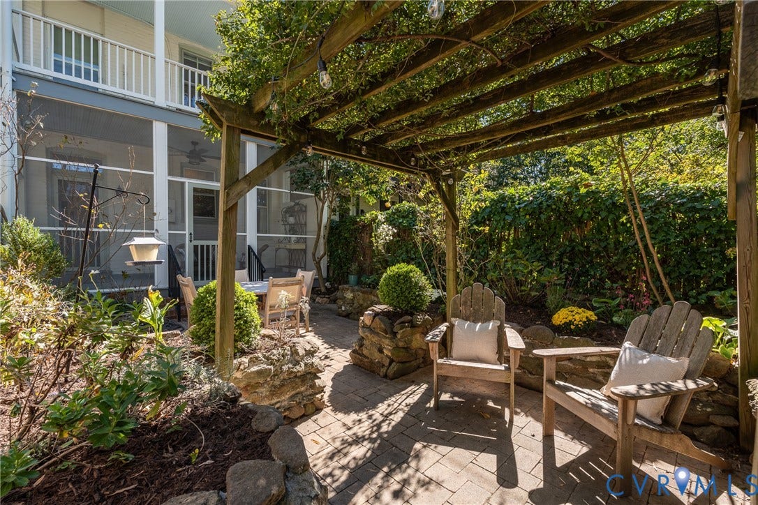 106 N Shields Avenue, The Fan, Richmond, VA 23220 Walled courtyard garden with a pergola and stone walls.