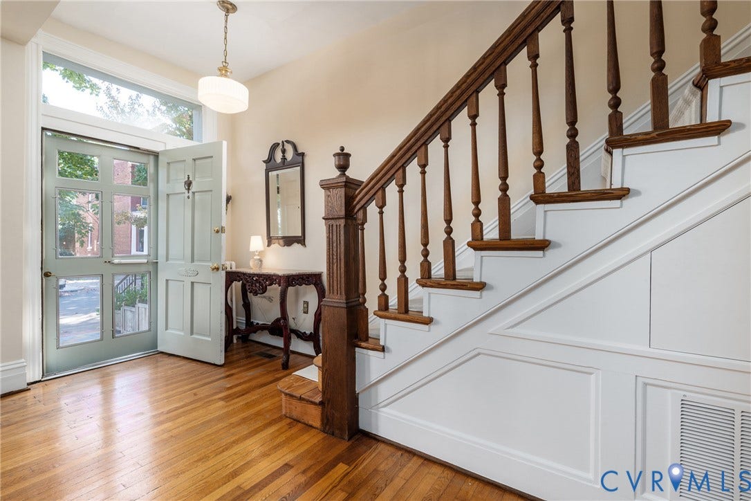 106 N Shields Avenue, The Fan, Richmond, VA 23220 Foyer with a transom over the front door and the original staircase.