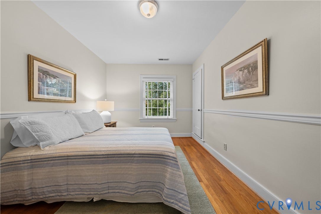 1203 Rothesay Circle, Windsor Farms, Richmond, VA 23221 Room featuring wood-finish flooring, chair rail molding, multi-pane window, and flush-mount ceiling lighting