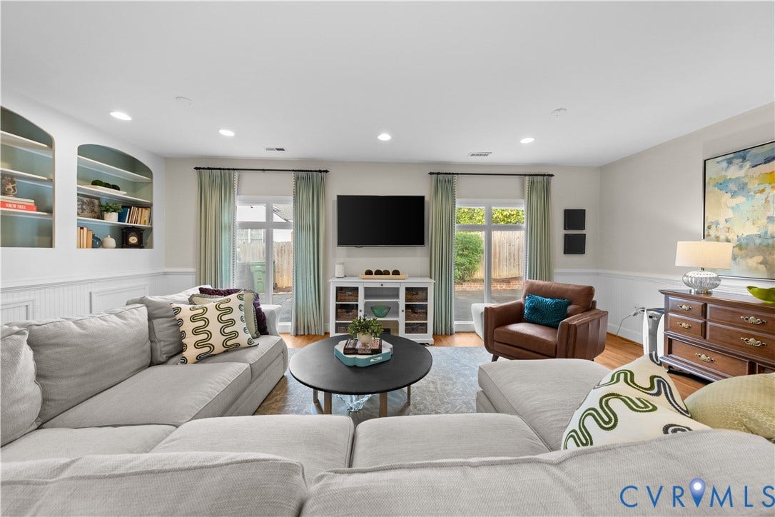 1203 Rothesay Circle, Windsor Farms, Richmond, VA 23221 Living area featuring recessed lighting, custom built-in arched shelving, wainscoting, and dual glass-paned doors with exterior access
