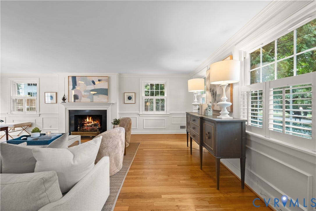 1203 Rothesay Circle, Windsor Farms, Richmond, VA 23221 Wood-finish flooring, fireplace with a mantle, paneled wall molding, multi-pane windows with plantation shutters, and crown molding