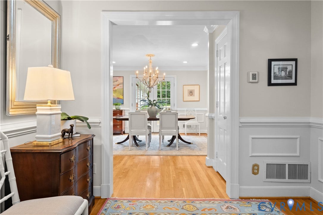 1203 Rothesay Circle, Windsor Farms, Richmond, VA 23221 Neutral wall paint with chair rail molding, wood-finish flooring, and a formal chandelier