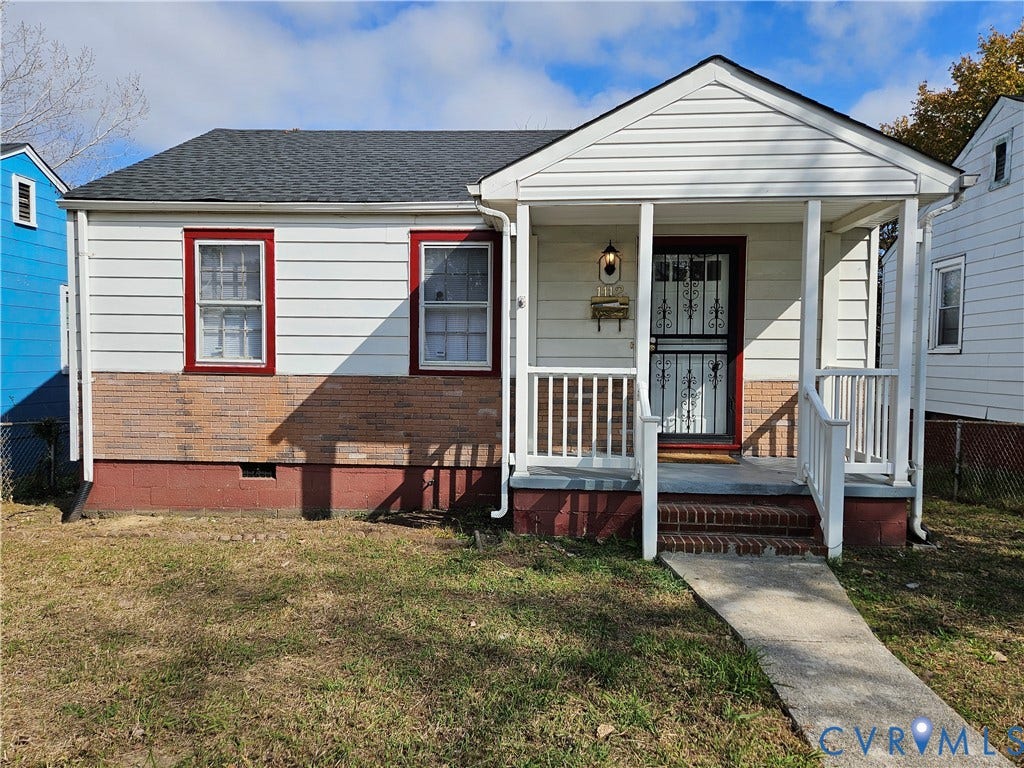 1112 E 15th Street, Richmond, VA 23224 Exterior featuring partial brick facade, horizontal siding, and a covered front porch with white railing