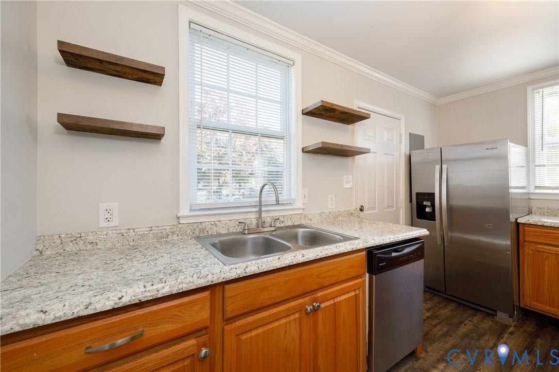 1010 E 17th Street, Oak Grove, Richmond, VA 23224 Kitchen featuring stone-finish countertops, stainless steel appliances, wood-finish cabinetry, wood-finish flooring, and wall-mounted wooden shelving