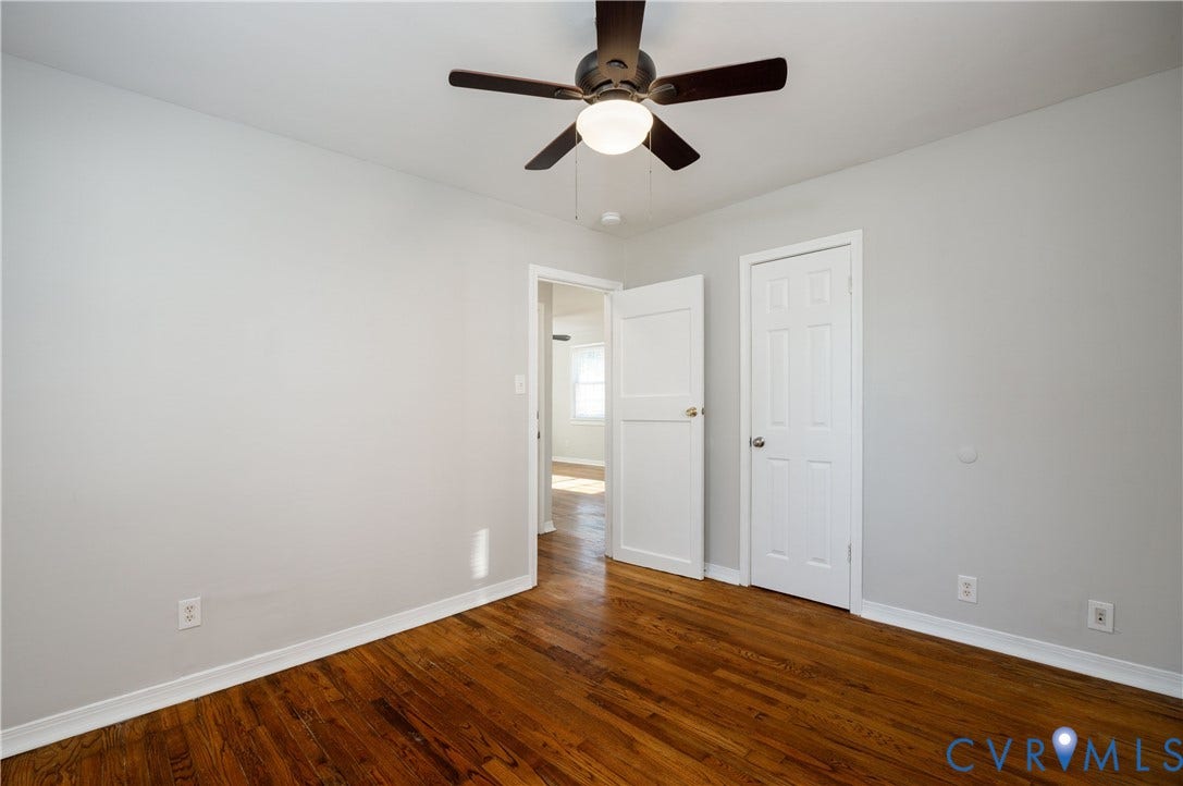 1010 E 17th Street, Oak Grove, Richmond, VA 23224 Room featuring wood-finish flooring, neutral wall paint, and a ceiling-mounted fan with integrated lighting