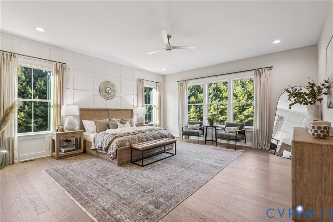 9275 Topeka Road, Quinton, VA 23141 Spacious bedroom featuring light wood-finish flooring, a decorative accent wall, recessed lighting, and a contemporary ceiling fan