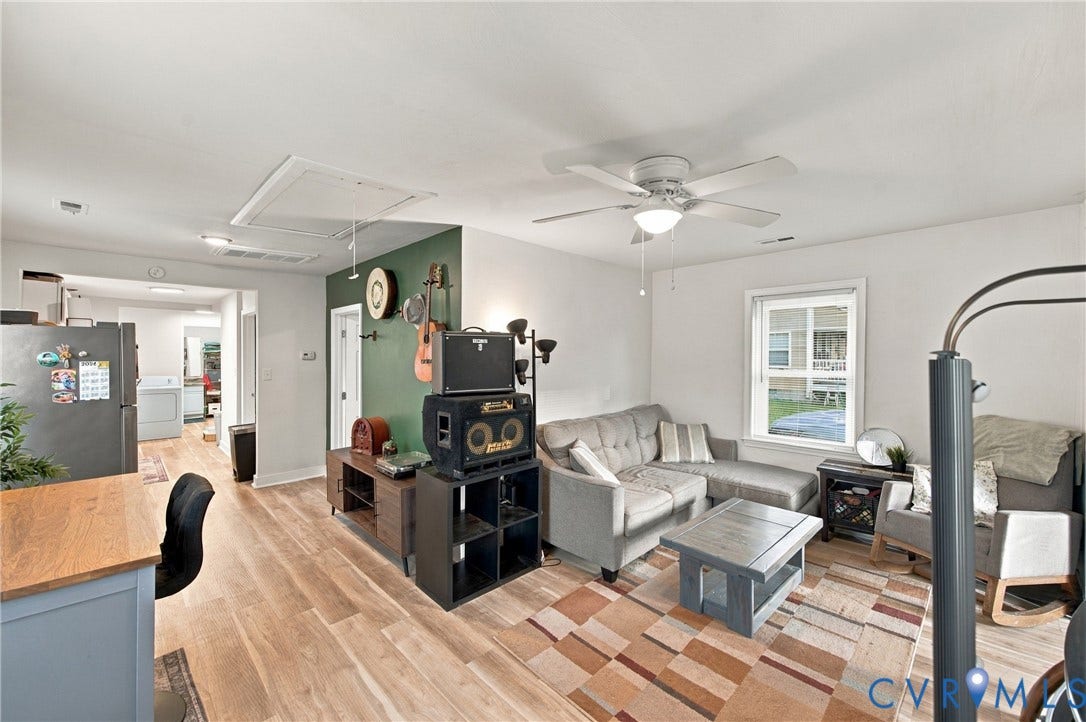 20 Victor Street, Geo Moss Estate, Hampton, VA 23669 Wood-finish flooring, ceiling fan with integrated lighting, and accent wall