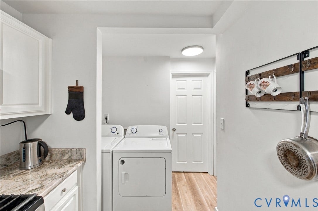 20 Victor Street, Geo Moss Estate, Hampton, VA 23669 Laundry area featuring stone-look countertop, white shaker-style cabinetry, wood-finish flooring, and a six-panel door