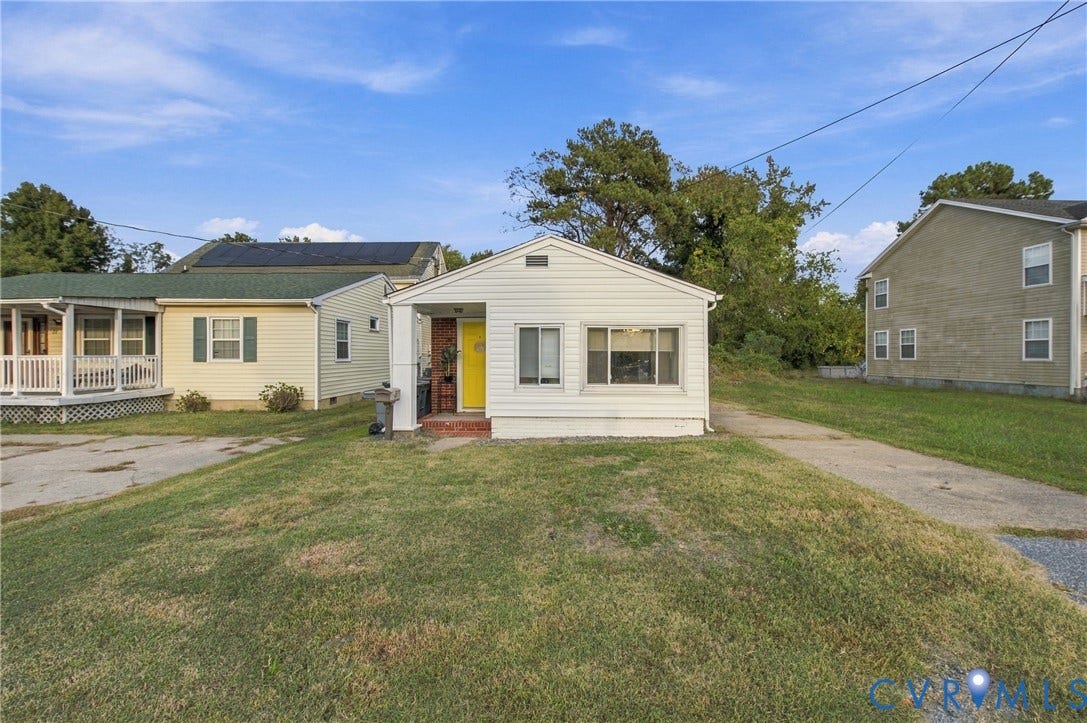 20 Victor Street, Geo Moss Estate, Hampton, VA 23669 Single-story exterior featuring white vinyl siding, a covered front entryway, and a concrete driveway