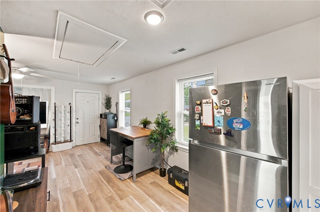 20 Victor Street, Geo Moss Estate, Hampton, VA 23669 Interior space featuring light-toned wood-finish flooring, dual windows with white trim, and a ceiling-mounted flush light fixture