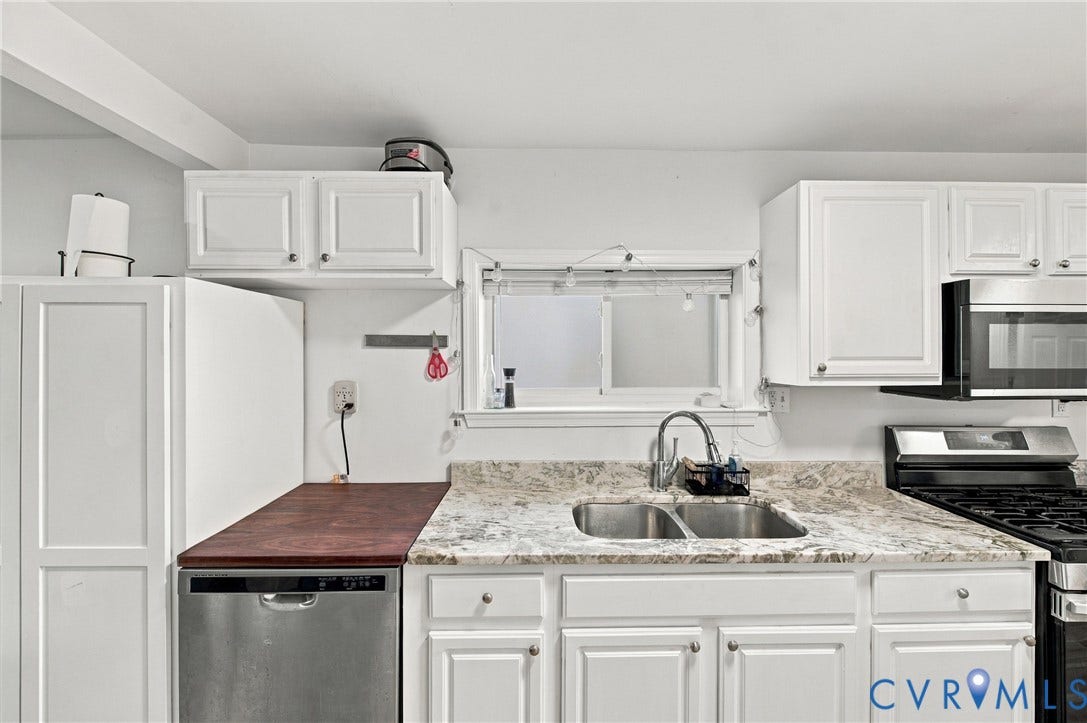 20 Victor Street, Geo Moss Estate, Hampton, VA 23669 Kitchen featuring white shaker-style cabinetry, stone-patterned countertops, a stainless steel double-basin sink with a gooseneck faucet, and an integrated stainless steel dishwasher
