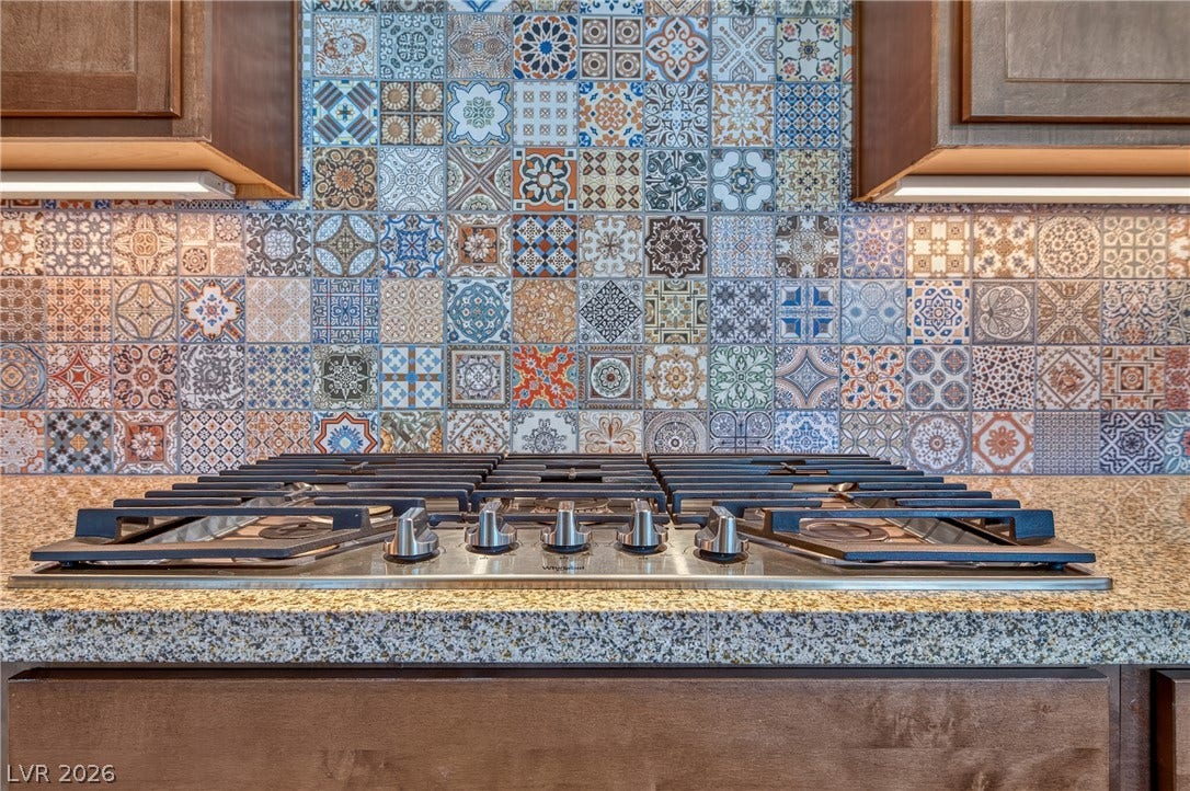 29 Porto Malaga Street, Henderson, NV 89011 Vibrant patterned tile backsplash creates a lively backdrop for kitchen meal preparation.