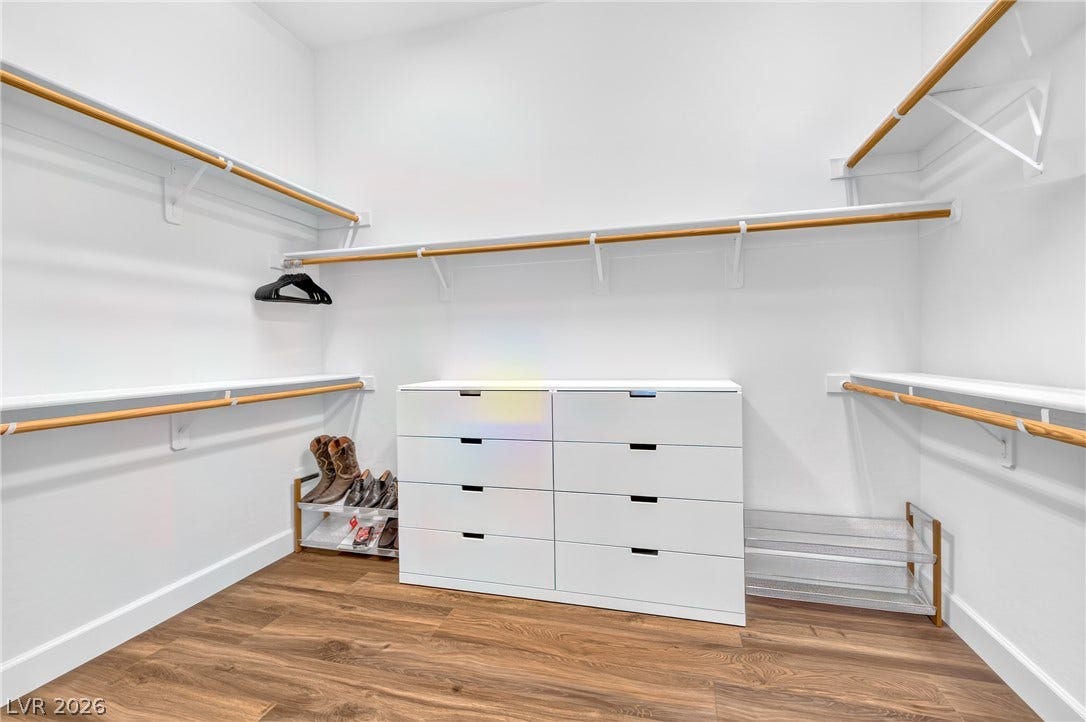 29 Porto Malaga Street, Henderson, NV 89011 Ample storage solutions define this practical walk-in closet, maximizing utility with its thoughtful design.