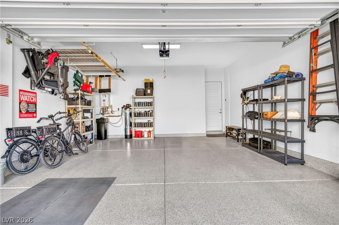 29 Porto Malaga Street, Henderson, NV 89011 A spotless garage offers ample space for vehicles and organized storage solutions.