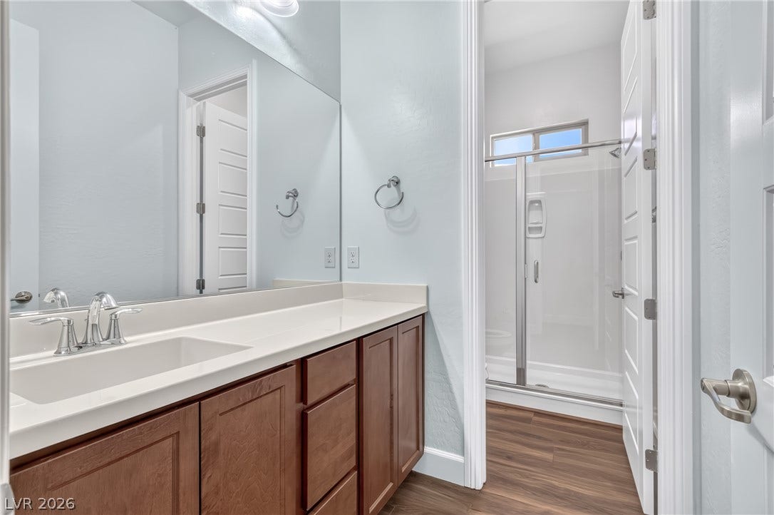 29 Porto Malaga Street, Henderson, NV 89011 A full bathroom featuring a sleek vanity and a modern walk-in shower, designed with clean, contemporary finishes.
