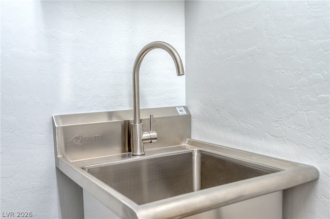 29 Porto Malaga Street, Henderson, NV 89011 A durable stainless steel utility sink provides practical functionality.