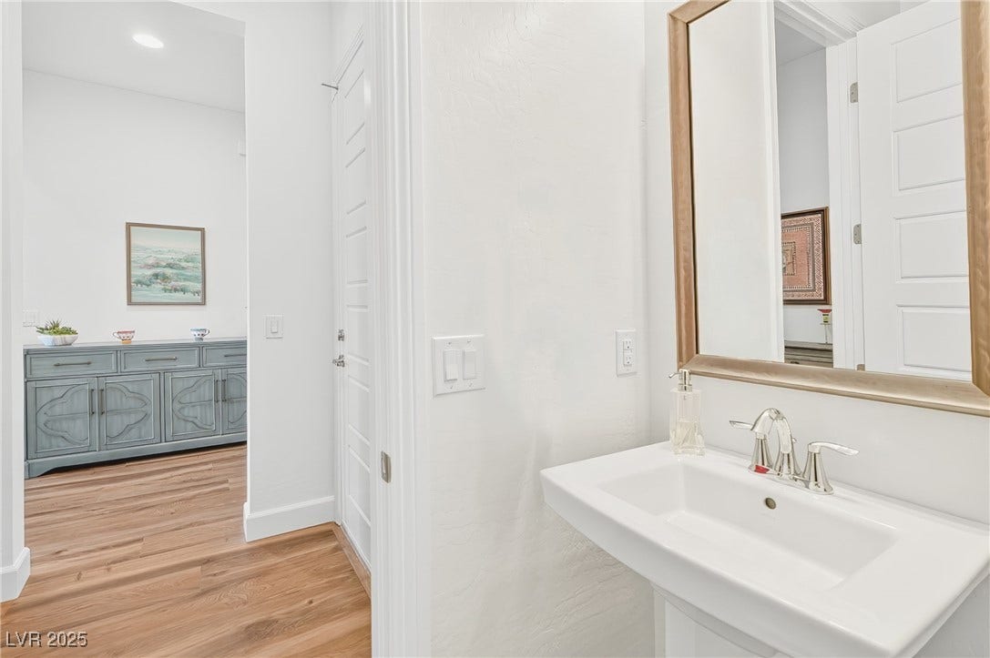 29 Porto Malaga Street, Henderson, NV 89011 A stylish powder room designed for convenience, offering a clean and functional space for guests.