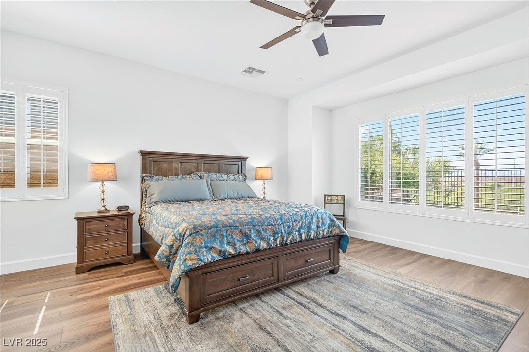29 Porto Malaga Street, Henderson, NV 89011 A spacious primary suite designed for comfort and relaxation, with beautiful views.