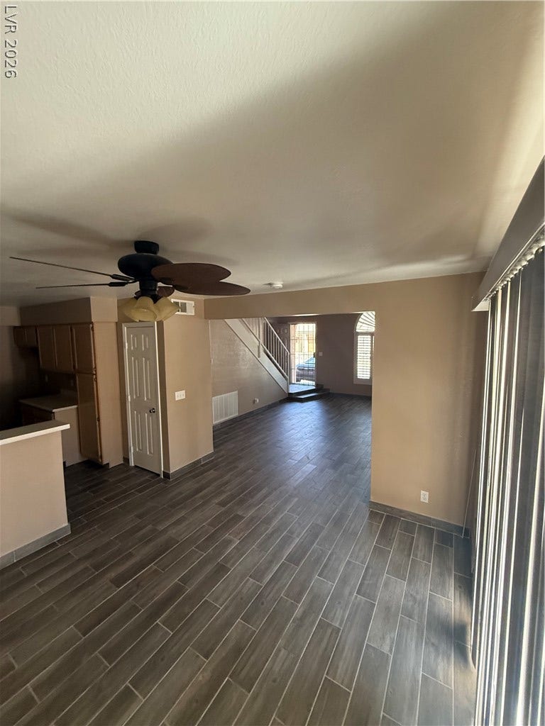 2823 Shannon Cove Drive, Henderson, NV 89074 High ceilings and modern wood-look tile flooring create an airy, structured split-level layout.