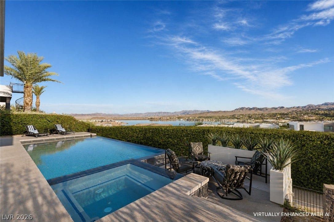 This outdoor oasis offers a refreshing pool and spa, perfect for enjoying scenic views.