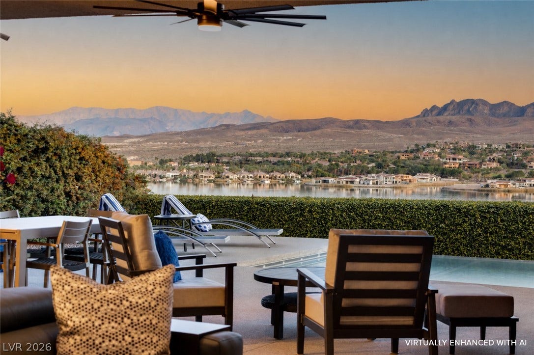 Enjoy evening entertaining with panoramic lake and mountain views from this expansive outdoor living area.
