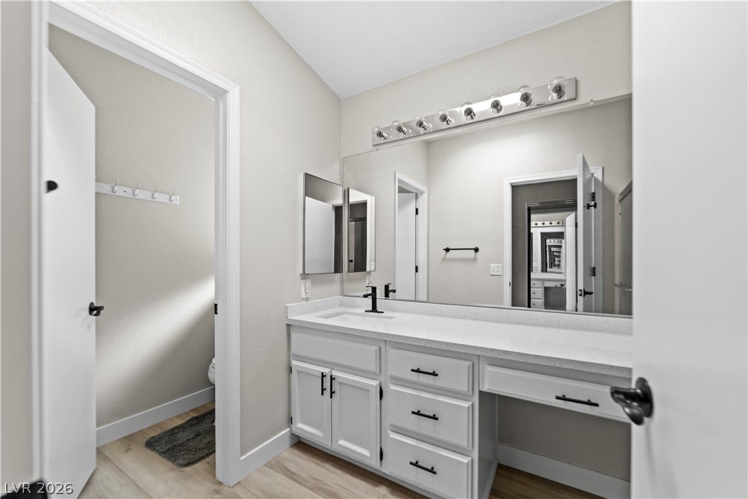 2154 High Mesa Drive, Henderson, NV 89012 A well-appointed bathroom offers a vanity with ample counter space and a large mirror.