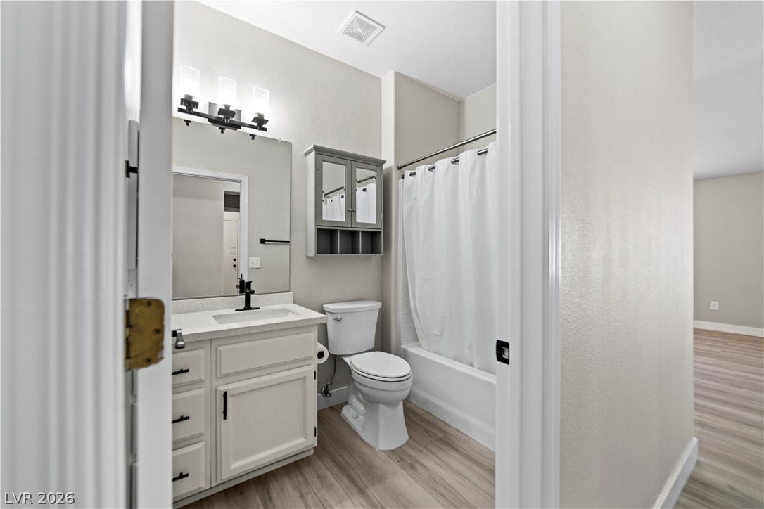 2154 High Mesa Drive, Henderson, NV 89012 A well-appointed bathroom with contemporary fixtures and a light wood-look floor.