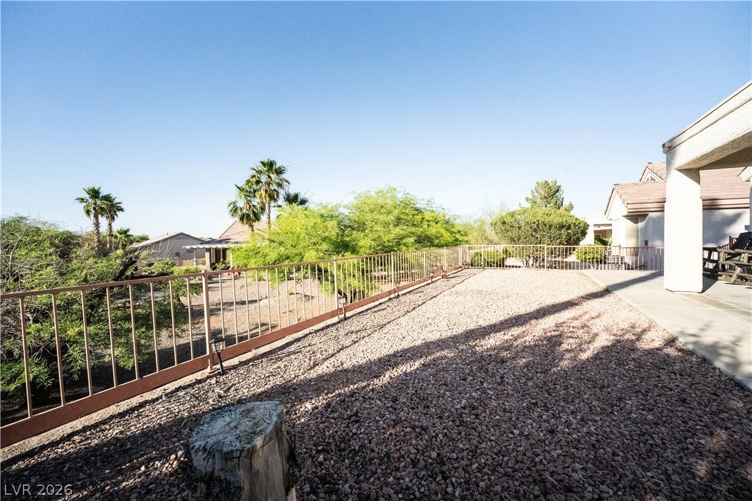 2154 High Mesa Drive, Henderson, NV 89012 This outdoor space features a gravel area, perfect for relaxed enjoyment under the clear sky.