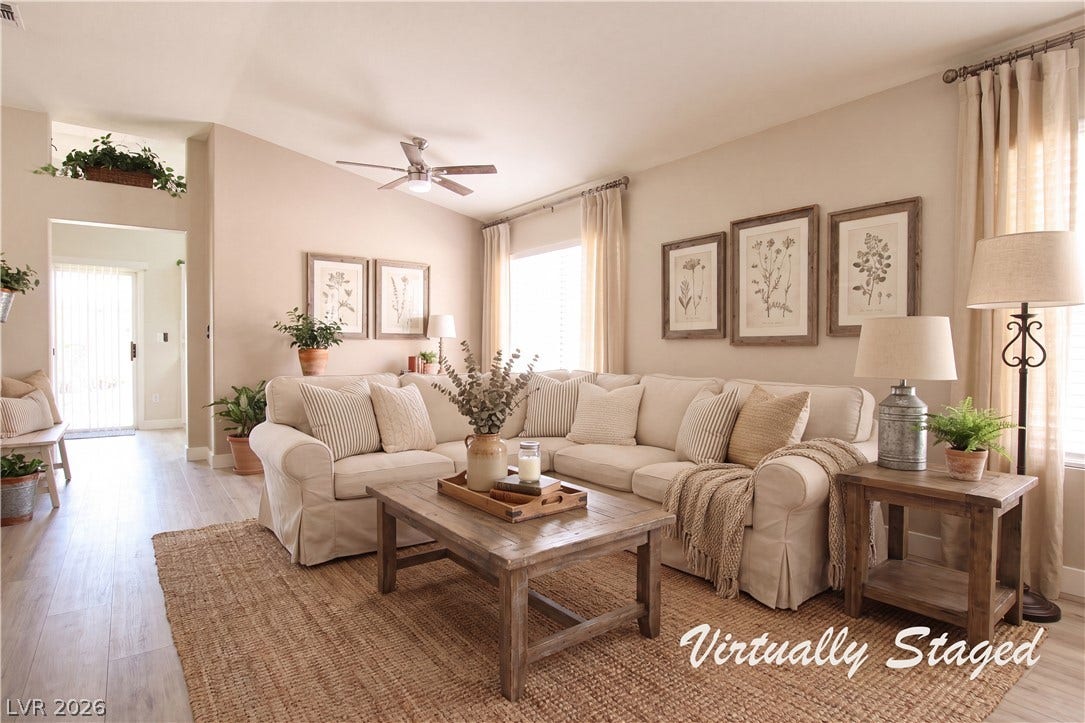 2154 High Mesa Drive, Henderson, NV 89012 A relaxed living area presents soft neutral tones and an inviting, comfortable sectional.