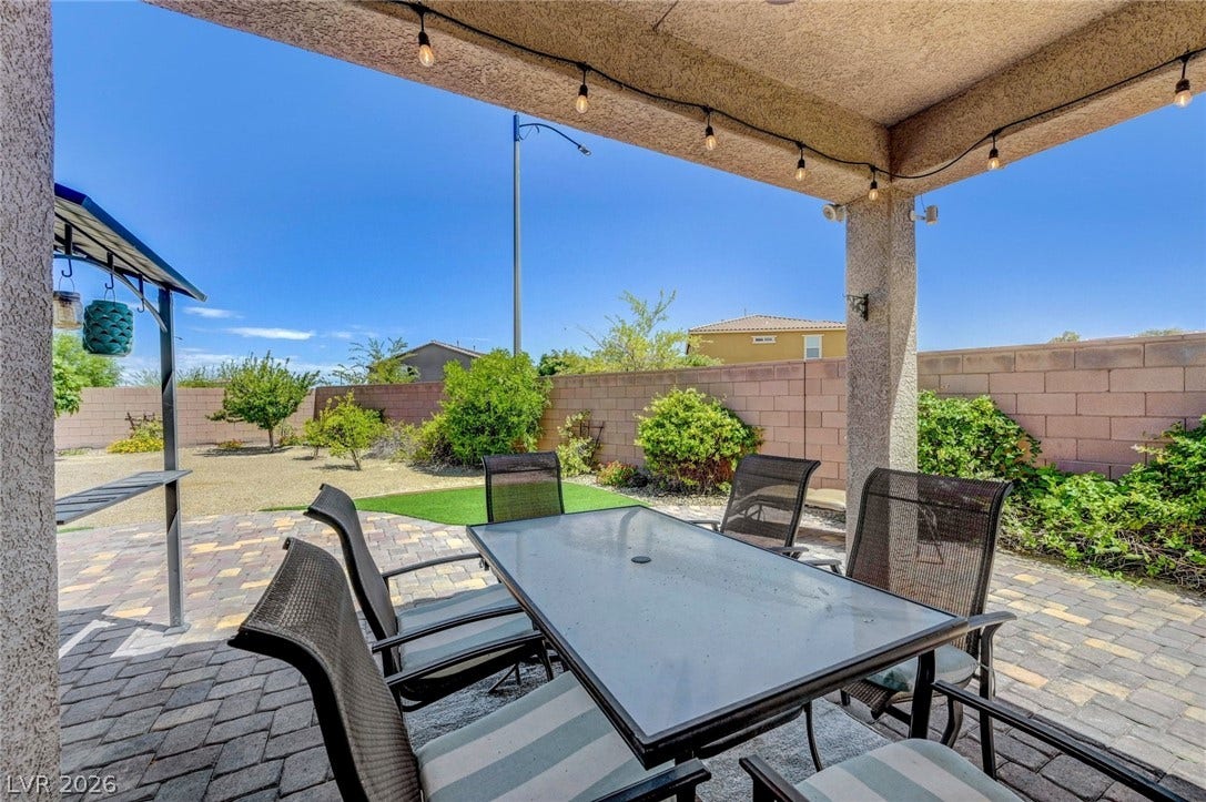 3086 Ripe Peak Lane, Henderson, NV 89044 This patio space offers an inviting setting for outdoor gatherings and relaxation.