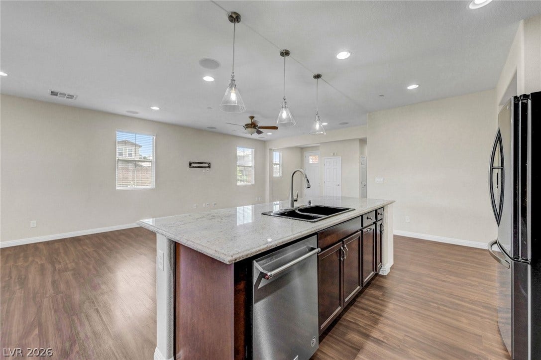 3086 Ripe Peak Lane, Henderson, NV 89044 This spacious kitchen offers a large island, sleek appliances, and an open layout perfect for entertaining.