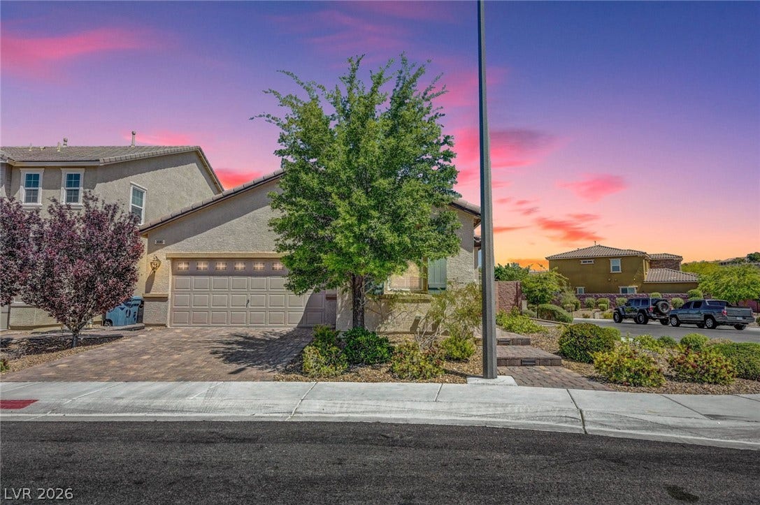 3086 Ripe Peak Lane, Henderson, NV 89044 This residence showcases a well-maintained exterior and a welcoming entryway.