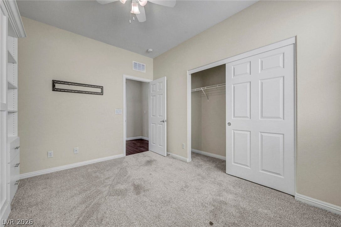 3086 Ripe Peak Lane, Henderson, NV 89044 This spacious bedroom offers comfortable carpet flooring and ample closet space, perfect for personalizing your private retreat.