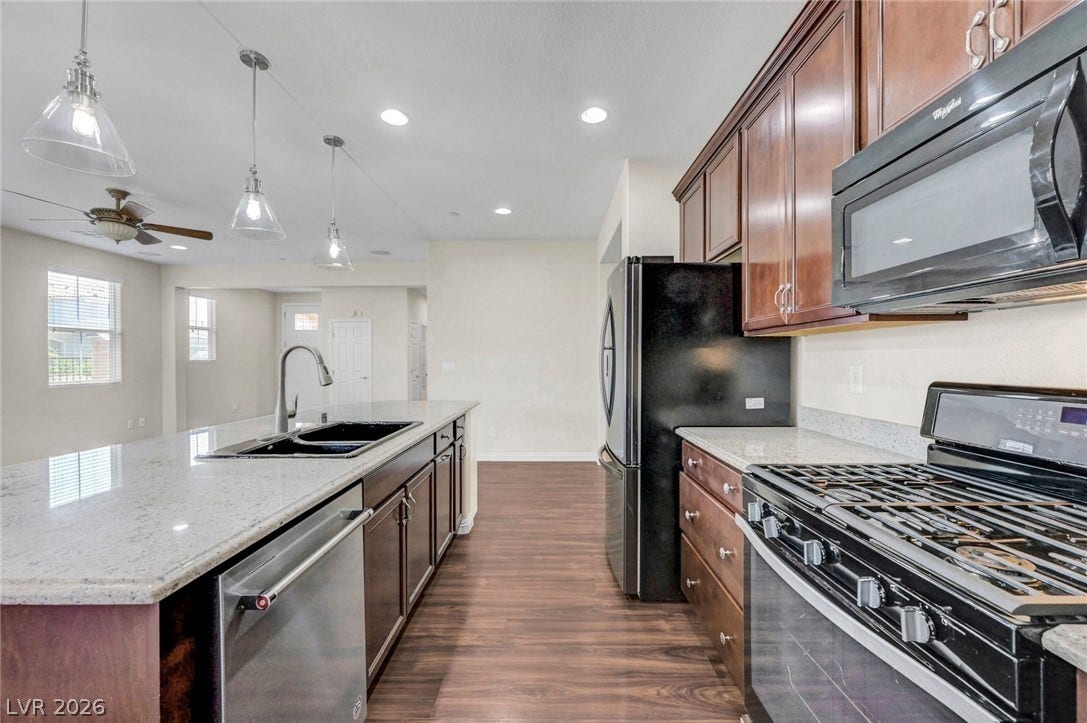 3086 Ripe Peak Lane, Henderson, NV 89044 This spacious kitchen features ample counter space, modern appliances, and a seamless flow for everyday living.